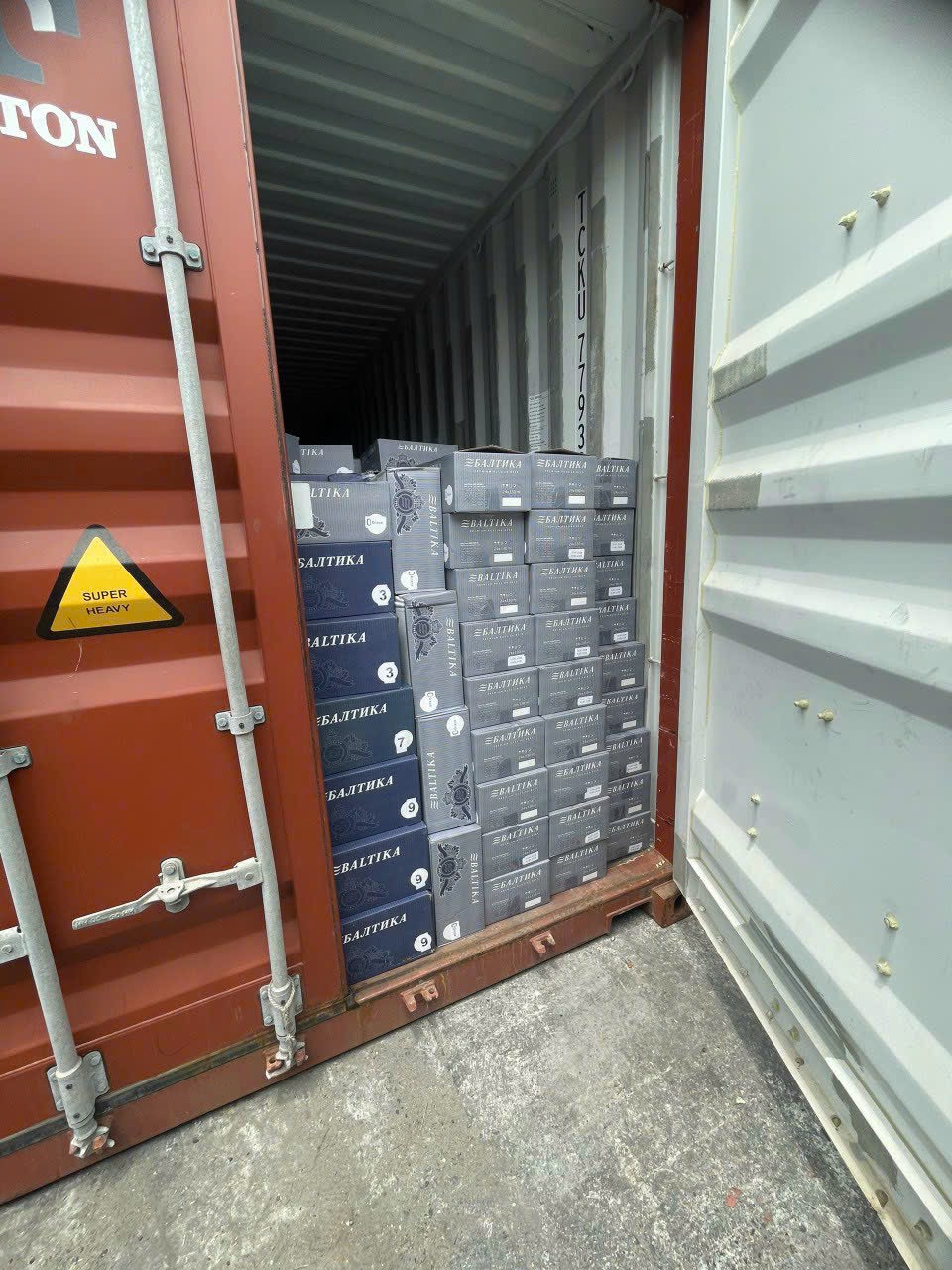 AlphaTrans container truck fleet handling UK export cargo at Cat Lai Port