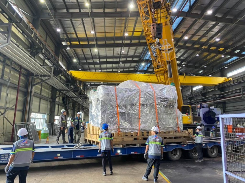 AlphaTrans rigging crew positioning press machine onto factory foundation