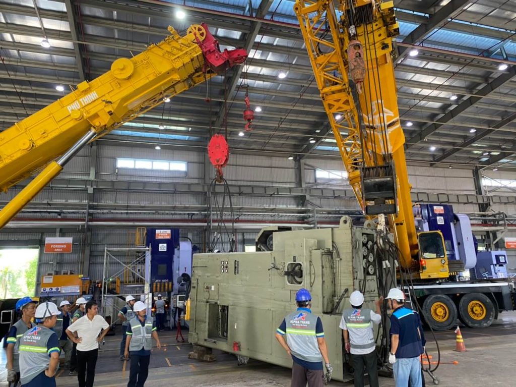 Rotating cold press machine to vertical position during rigging