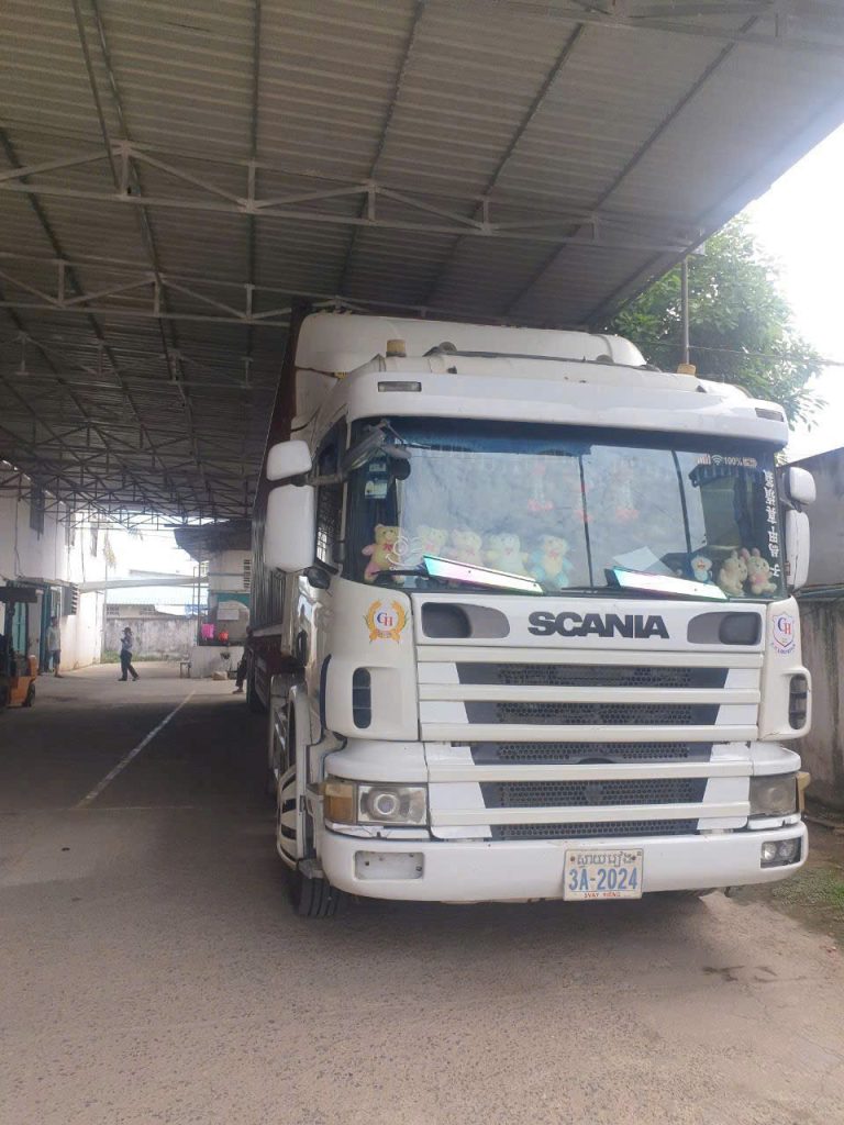 AlphaTrans container truck at Moc Bai–Bavet border gate