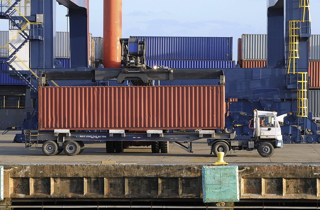 AlphaTrans truck delivering an imported container from the USA to a warehouse in Vietnam
